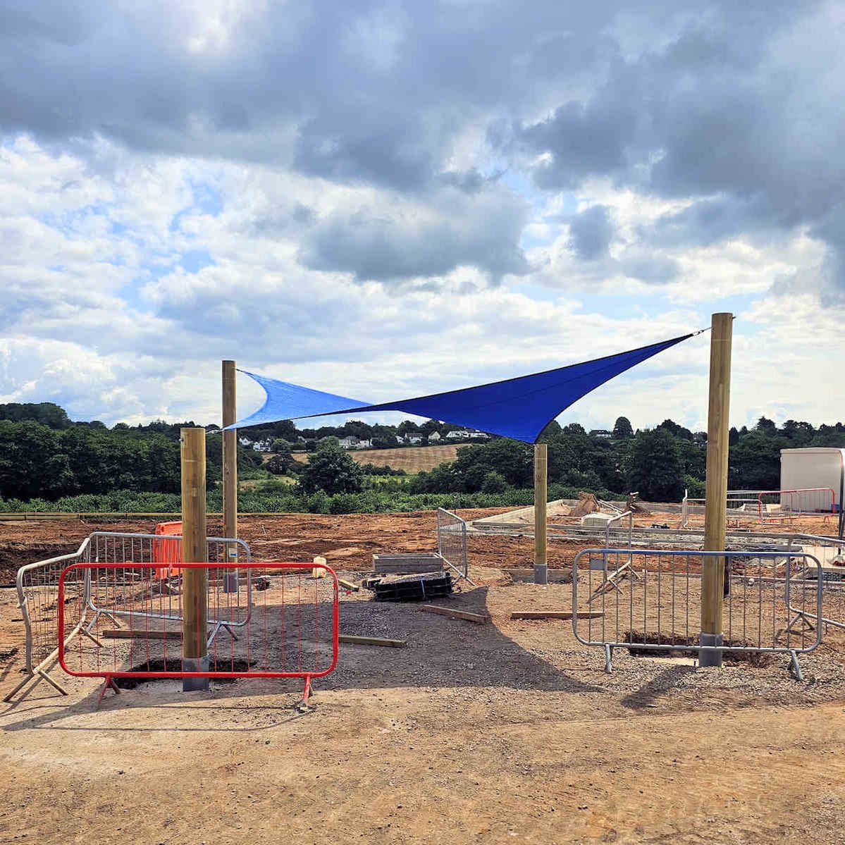 Shade sail with timber posts, installed at a new build primary school in Wales