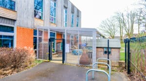 School canopy with polycarbonate side walls to provide weather protection