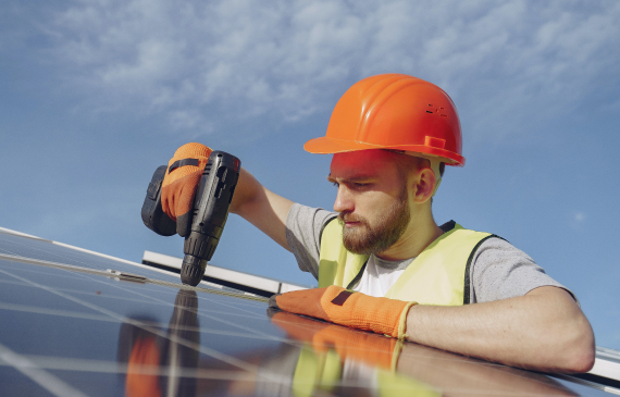 Man installing solar panel